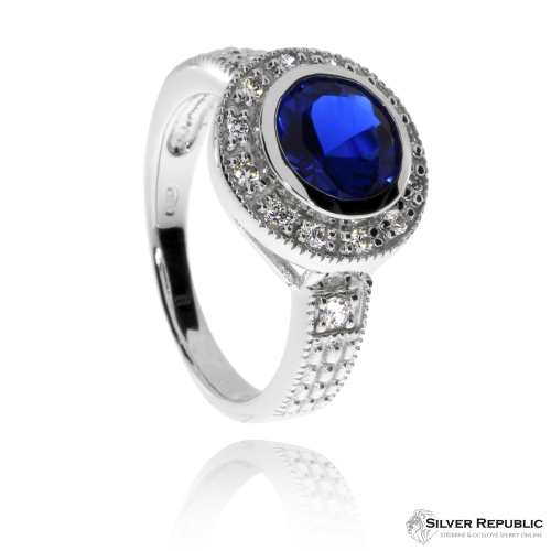 Stříbrný prsten se zirkony (cubic zirconia) - modrý středový kámen