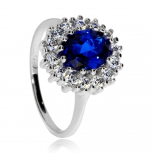 Stříbrný prsten s čirými zirkony a modrým syntetickým kamenem