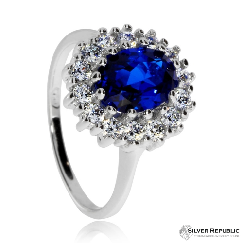 Stříbrný prsten s čirými zirkony a modrým syntetickým kamenem